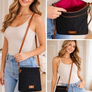 Dooney and Burke Black and hot pink interior Crossbody Bag with Tan Strap